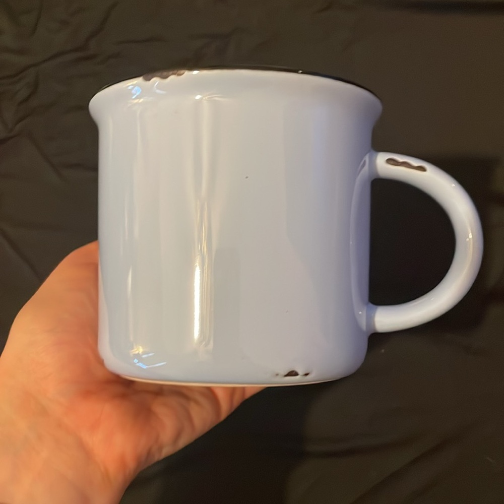 Lavender ceramic mug with rustic accents.